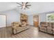 Cozy living room with a stone fireplace, neutral walls, new flooring and comfortable seating at 6500 Chickasaw Dr, Douglasville, GA 30135