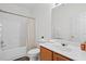 Bathroom with a combined shower and tub, and a white vanity with ample counter space at 1228 W Oaks Way, Woodstock, GA 30188