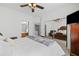 Bedroom with a large closet, comfortable bed, and views into the bathroom and laundry room at 1228 W Oaks Way, Woodstock, GA 30188