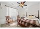 Well-lit bedroom with a four-poster bed and decorative accents at 1228 W Oaks Way, Woodstock, GA 30188