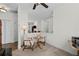 A cozy bonus room with neutral decor, and view of the living area with a fireplace at 1228 W Oaks Way, Woodstock, GA 30188