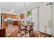 Bright kitchen and dining area with stainless steel appliances and ample sunlight at 1228 W Oaks Way, Woodstock, GA 30188