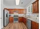 Modern kitchen with stainless steel appliances and ample counter space at 1228 W Oaks Way, Woodstock, GA 30188