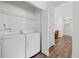 Convenient laundry room with modern washer and dryer units at 1228 W Oaks Way, Woodstock, GA 30188