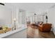 Open-concept living area with hardwood floors, fireplace, and plenty of natural light at 1228 W Oaks Way, Woodstock, GA 30188