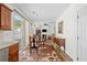 Open-concept kitchen, dining and living area with ample natural light at 1228 W Oaks Way, Woodstock, GA 30188