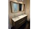Bathroom vanity with a double sink, quartz countertops and a large framed mirror at 3268 Mae Ave, Brookhaven, GA 30319