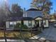 Charming bungalow with a fenced yard, stone accents, and a paved driveway on a sunny day at 3268 Mae Ave, Brookhaven, GA 30319