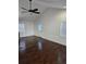 Spacious living room with dark hardwood floors, ample natural light, and a neutral color palette at 3268 Mae Ave, Brookhaven, GA 30319
