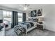 A contemporary bedroom with bold artwork, large windows, and modern furnishings at 6102 Marigold Way, Atlanta, GA 30349