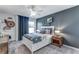 A stylish bedroom featuring a statement wall, comfortable bed, and natural light at 6102 Marigold Way, Atlanta, GA 30349