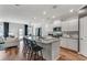 Open kitchen with a center island, modern appliances, and seamless flow into the living area at 6102 Marigold Way, Atlanta, GA 30349