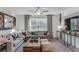 A cozy living room featuring a large sectional sofa and stylish decor with natural light at 6102 Marigold Way, Atlanta, GA 30349