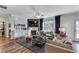 Inviting living room with a fireplace, large windows, and comfortable seating for relaxation and gatherings at 6102 Marigold Way, Atlanta, GA 30349