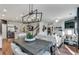 Open-concept living and dining area with hardwood floors, modern lighting, and a seamless flow for entertaining at 6102 Marigold Way, Atlanta, GA 30349