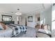 A beautifully staged main bedroom showcasing elegant decor and an ensuite bathroom at 6102 Marigold Way, Atlanta, GA 30349