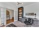 Elegant office featuring a large bookcase, desk, and comfortable seating perfect for a productive work environment at 6102 Marigold Way, Atlanta, GA 30349