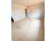 Bedroom featuring neutral paint, with electrical outlets and a doorway to another room at 11598 E Lovejoy Rd, Hampton, GA 30228