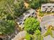 Aerial view of the condo complex with mature trees and parking lot at 1401 Parkaire Xing, Marietta, GA 30068