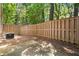 Fenced backyard with a concrete patio and an air conditioning unit at 1401 Parkaire Xing, Marietta, GA 30068