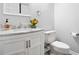 Bathroom features marble countertop vanity, toilet and neutral paint at 1401 Parkaire Xing, Marietta, GA 30068