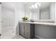 Bright bathroom offers a granite countertop vanity with storage and a shower-tub combination at 1401 Parkaire Xing, Marietta, GA 30068