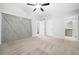 Spacious bedroom boasts a ceiling fan and barn door closet with easy access to the bathroom at 1401 Parkaire Xing, Marietta, GA 30068