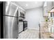 Kitchen boasts stainless steel appliances, gray cabinets and subway tile backsplash at 1401 Parkaire Xing, Marietta, GA 30068