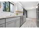 Kitchen boasts stainless steel appliances, gray cabinets and subway tile backsplash at 1401 Parkaire Xing, Marietta, GA 30068