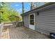 Wooden back deck provides relaxation with access to wooded backyard area at 230 Oakridge Se Dr, Cartersville, GA 30121