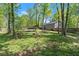 Large wooded back yard with mature trees allows plenty of space for recreation at 230 Oakridge Se Dr, Cartersville, GA 30121