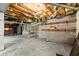 Unfinished basement with exposed ceiling, concrete floors, block wall, and built in shelving ready for your creative ideas at 230 Oakridge Se Dr, Cartersville, GA 30121