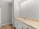 Bathroom with a single sink vanity and a neutral-toned countertop with vanity mirror and lighting at 230 Oakridge Se Dr, Cartersville, GA 30121
