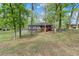 Charming home with a red porch, stone accents, and lots of trees on a spacious lawn at 230 Oakridge Se Dr, Cartersville, GA 30121