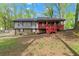 Charming split-level home with stone accents and a inviting red porch at 230 Oakridge Se Dr, Cartersville, GA 30121
