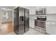 Eat-in kitchen offers stainless appliances, white cabinets and tile backsplash at 230 Oakridge Se Dr, Cartersville, GA 30121