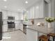 Beautiful kitchen features white cabinets, stainless steel appliances, and granite countertops at 230 Oakridge Se Dr, Cartersville, GA 30121