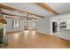 Bright living room features hardwood floors, ceiling fan, and access to the kitchen at 230 Oakridge Se Dr, Cartersville, GA 30121