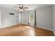 Bright main bedroom with hardwood floors, ceiling fan and neutral walls at 230 Oakridge Se Dr, Cartersville, GA 30121