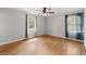 Main bedroom with hardwood floors, ceiling fan and neutral walls at 230 Oakridge Se Dr, Cartersville, GA 30121