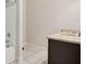 Bright bathroom features a tiled floor, granite countertop vanity and combination shower and tub at 237 Lotus Ln, Covington, GA 30016
