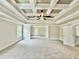 Spacious living room with trey ceiling, fan and carpet floors offers plenty of natural light at 237 Lotus Ln, Covington, GA 30016