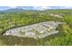 Aerial view of a residential community surrounded by lush greenery at 1439 Brookmere Way, Cumming, GA 30040
