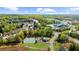Scenic aerial view of the neighborhood showcasing its green surroundings, pool, and recreational facilities at 1439 Brookmere Way, Cumming, GA 30040