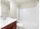Bathroom featuring a single sink vanity and shower with white wall tiles at 1439 Brookmere Way, Cumming, GA 30040