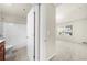 View from a hallway of a bathroom with a vanity and shower, next to a bedroom at 1439 Brookmere Way, Cumming, GA 30040