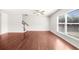 Bright living room with large windows offering natural light and staircase access at 1439 Brookmere Way, Cumming, GA 30040