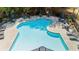Stunning aerial view of the community pool featuring a unique shape and plenty of lounging space at 1439 Brookmere Way, Cumming, GA 30040