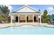 Inviting community pool with shallow entry and a covered lounging area for residents to enjoy at 1439 Brookmere Way, Cumming, GA 30040