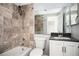 Bathroom featuring decorative tile, a shower-tub combo, and a sleek vanity at 1501 Clairmont Rd # 1818, Decatur, GA 30033